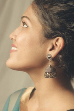 woman wearing silver stud earring