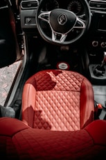 red car seat in car