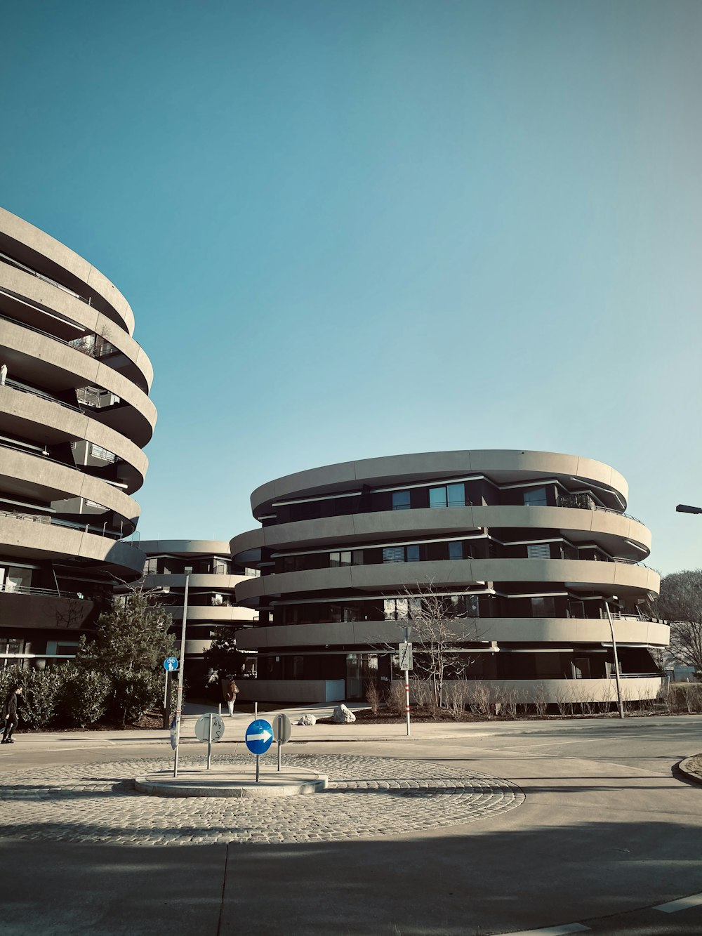 people walking near white concrete building during daytime