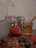 A rustic kitchen scene with honey jars, fresh bread, and a small pot of honey being drizzled.