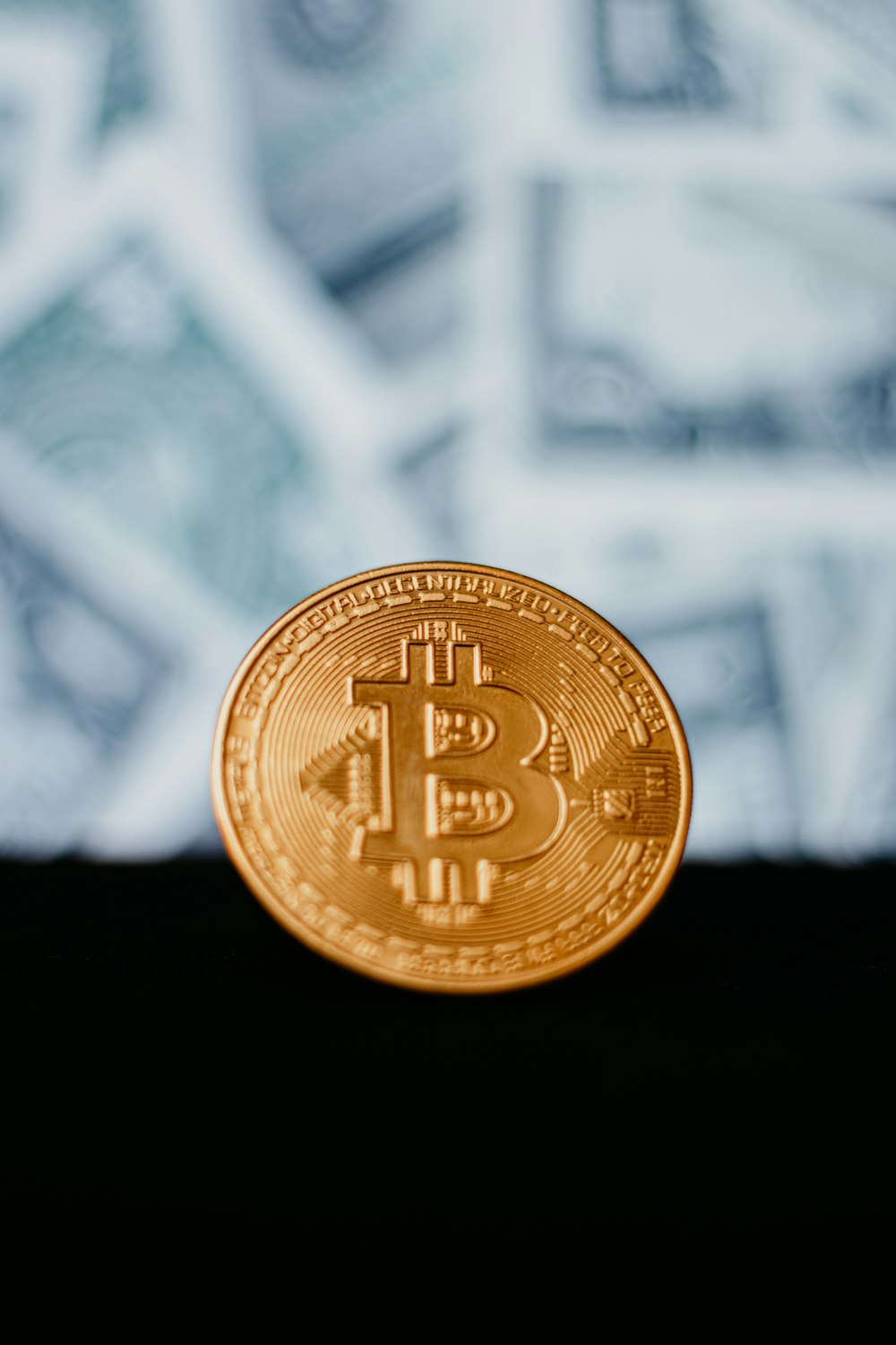 gold round coin on white metal fence