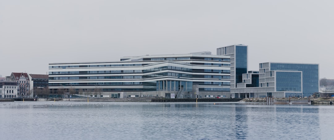 white concrete building near body of water during daytime