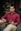 man in red dress shirt holding black tablet computer