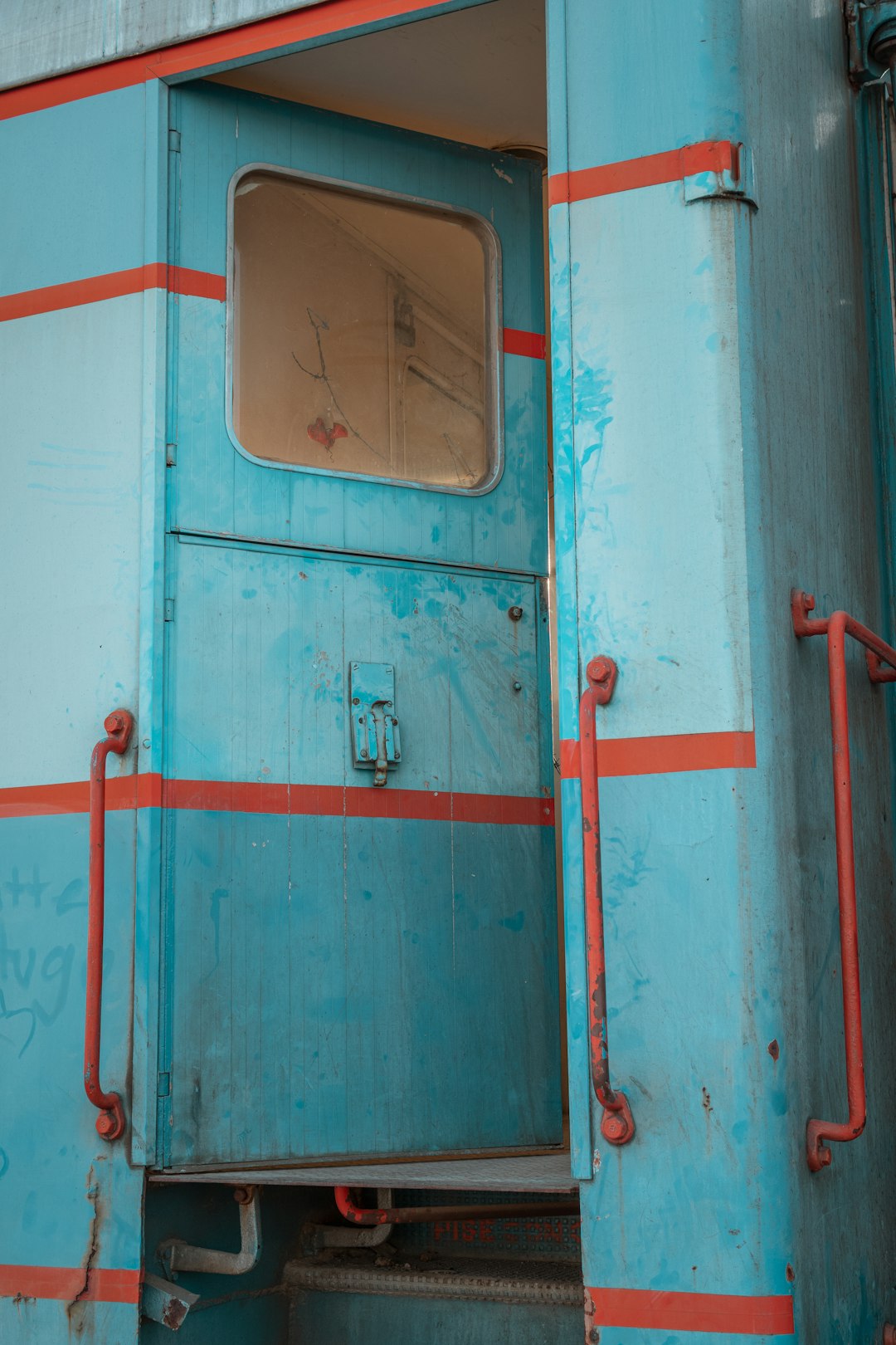 red metal door with white door lever