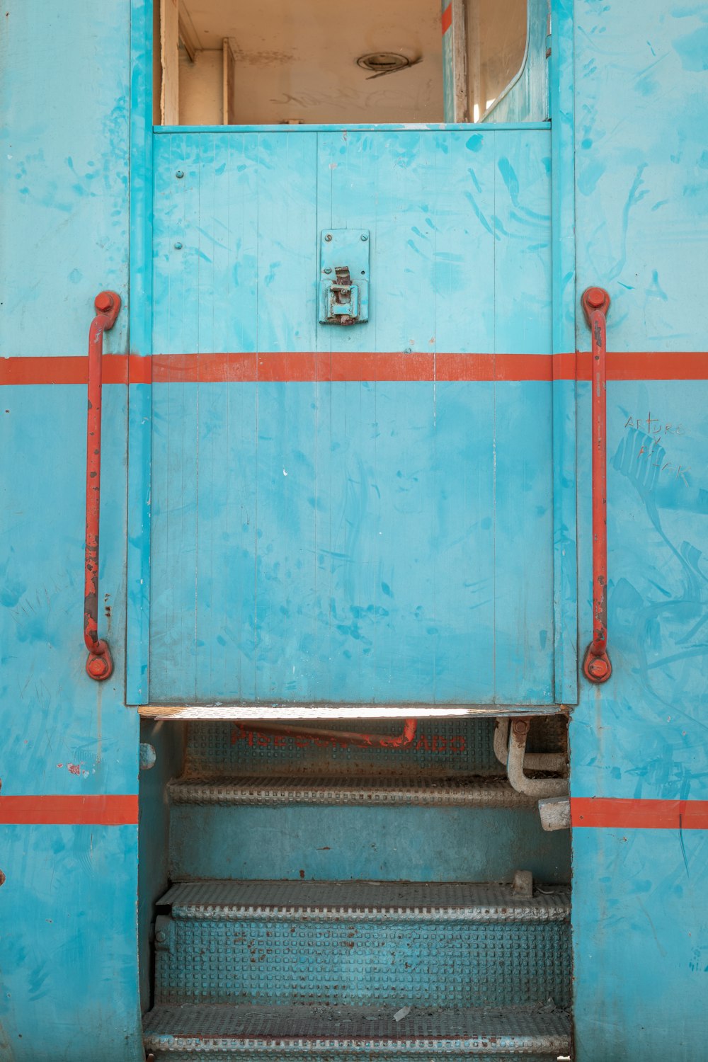 blue and red metal door