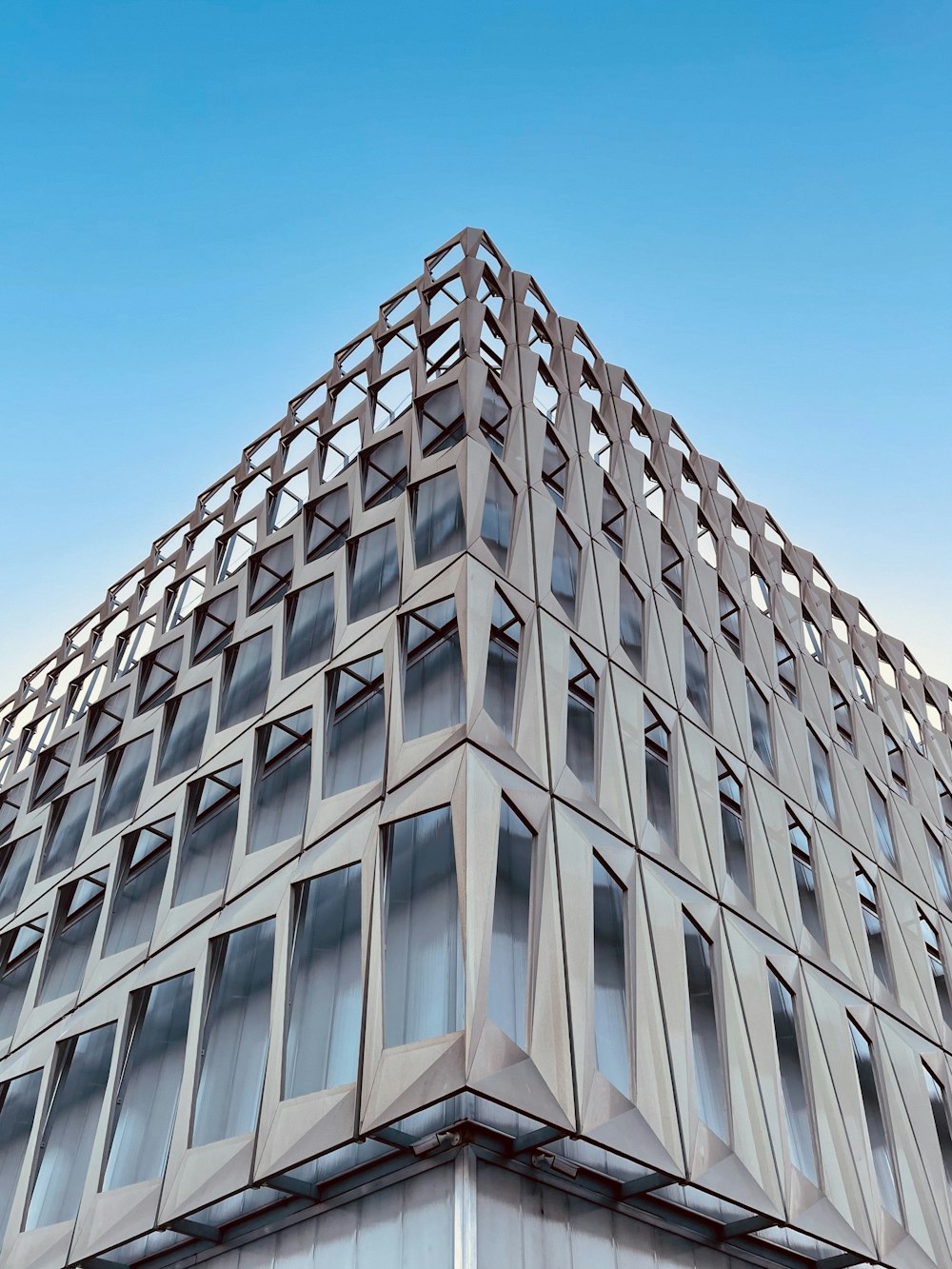 white concrete building under blue sky during daytime