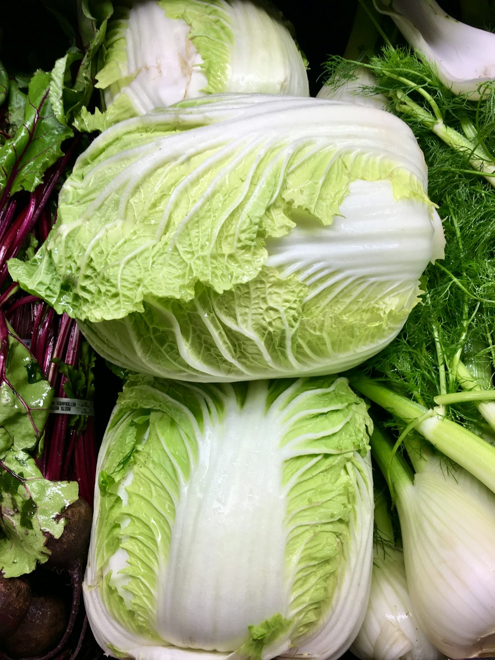 green lettuce on red plastic container