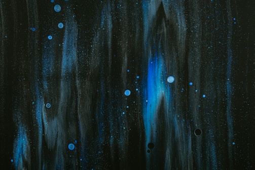 A dark background with swirling cosmic elements.