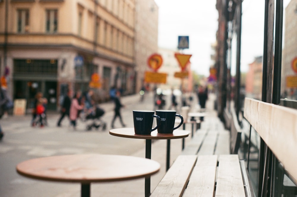 black ceramic mug on brown wooden table