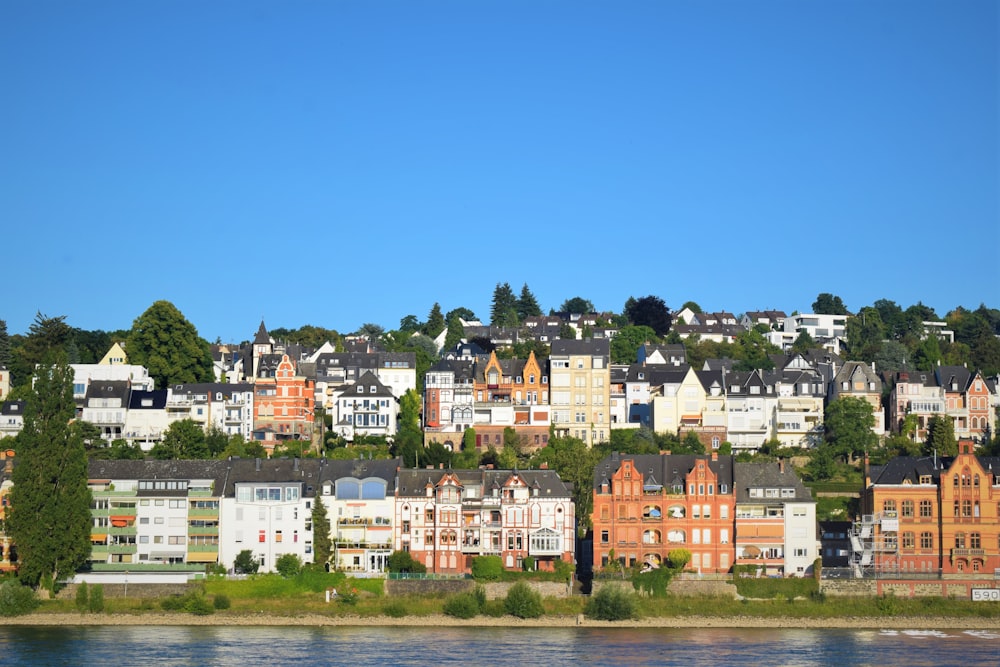 white and brown concrete houses under blue sky during daytime