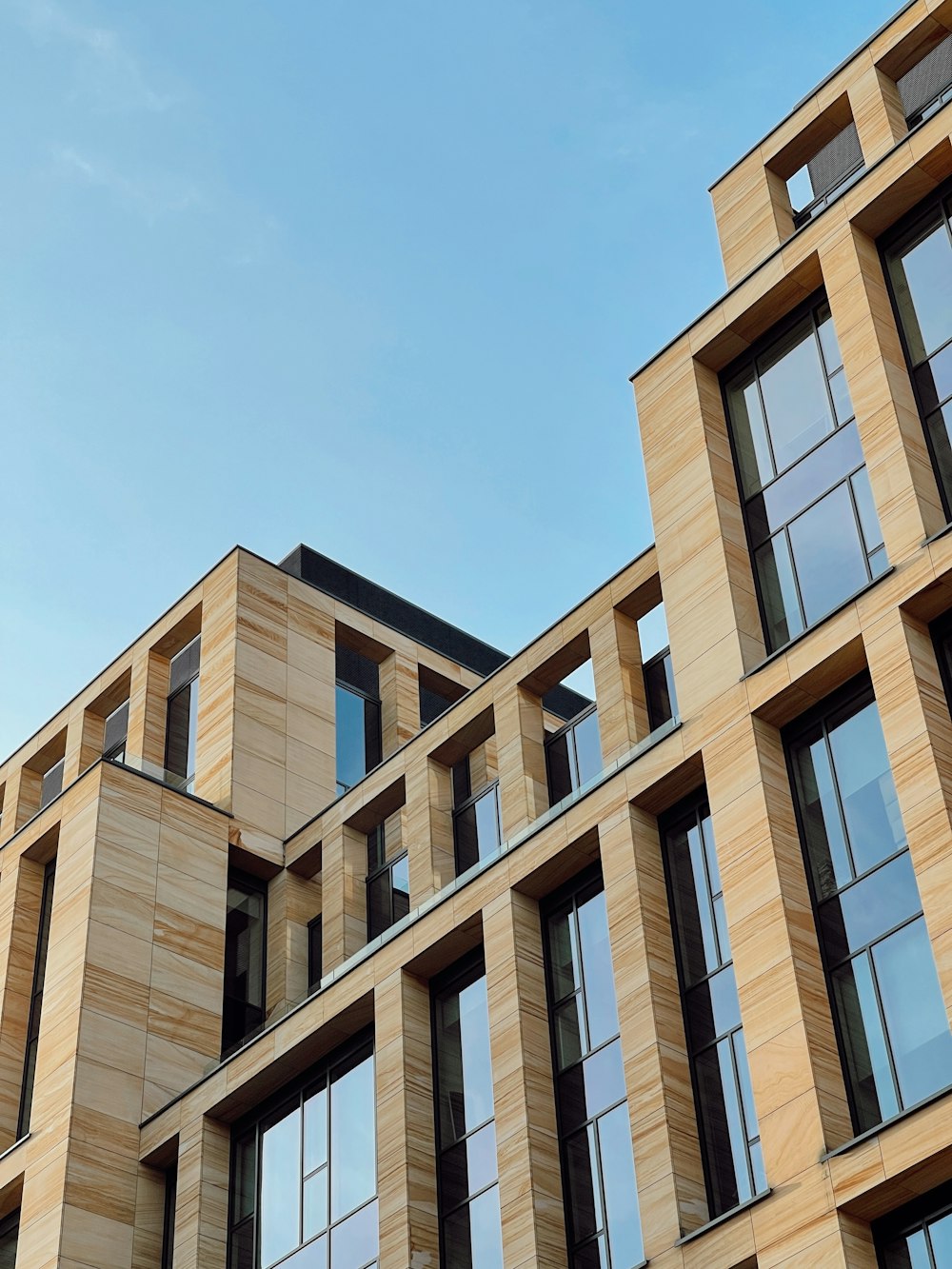 brown concrete building under blue sky during daytime