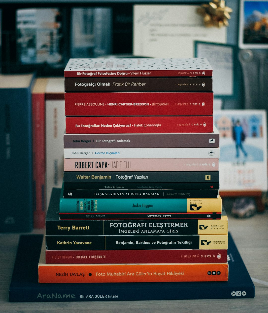 red and white books on brown wooden table