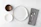 Close-up of a custom dinner set with plates and spoons arranged neatly on a wooden table