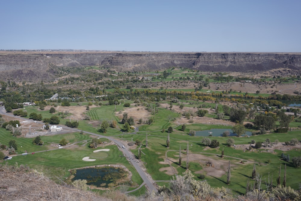 a golf course in the middle of a valley