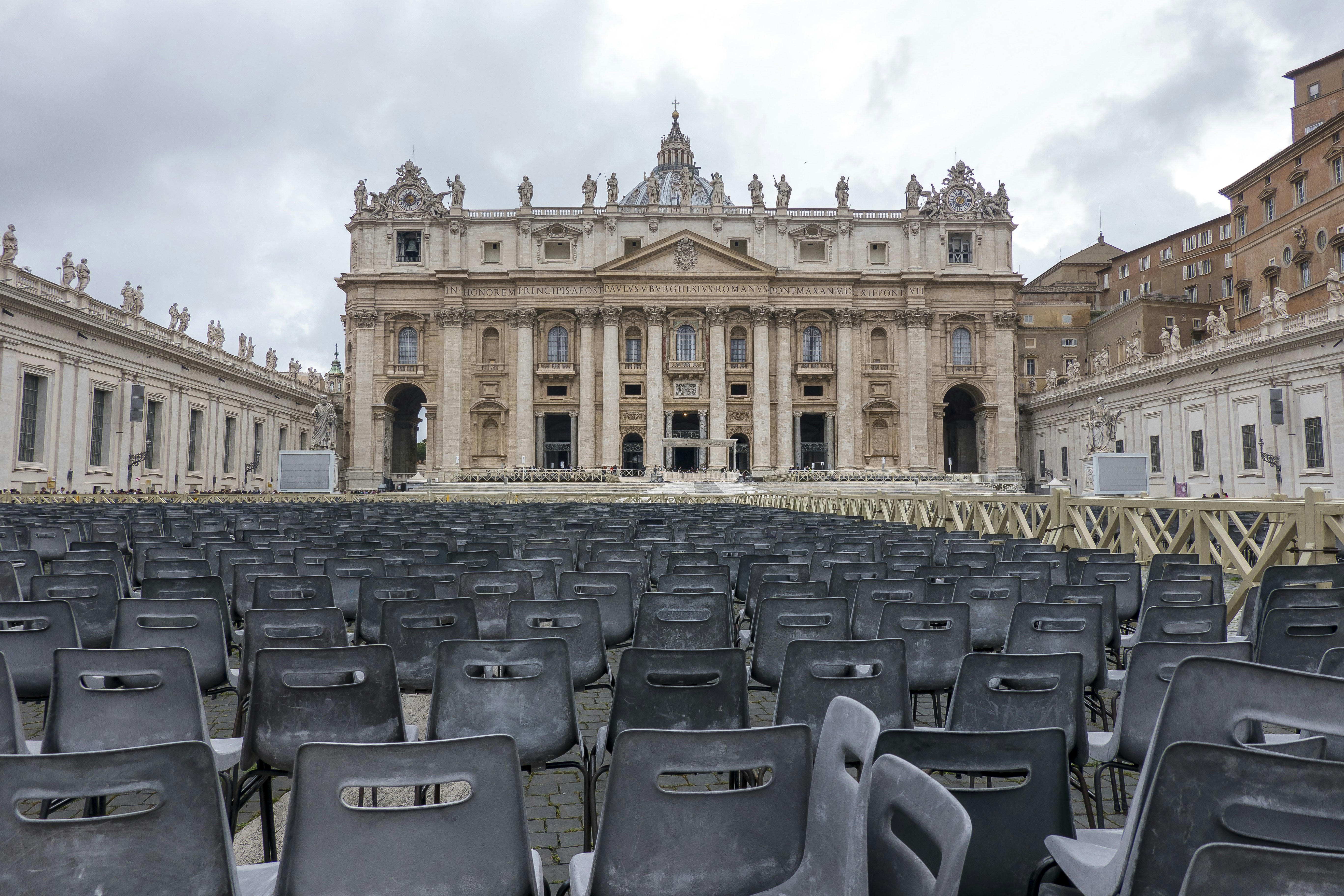 gray chairs near brown concrete building during daytime