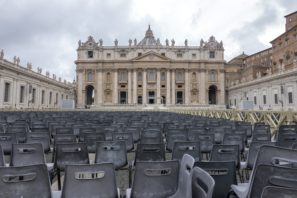 gray chairs near brown concrete building during daytime