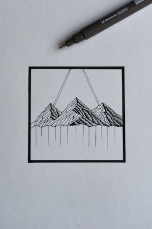 Minimalistic line art tattoo of a mountain range on wrist
