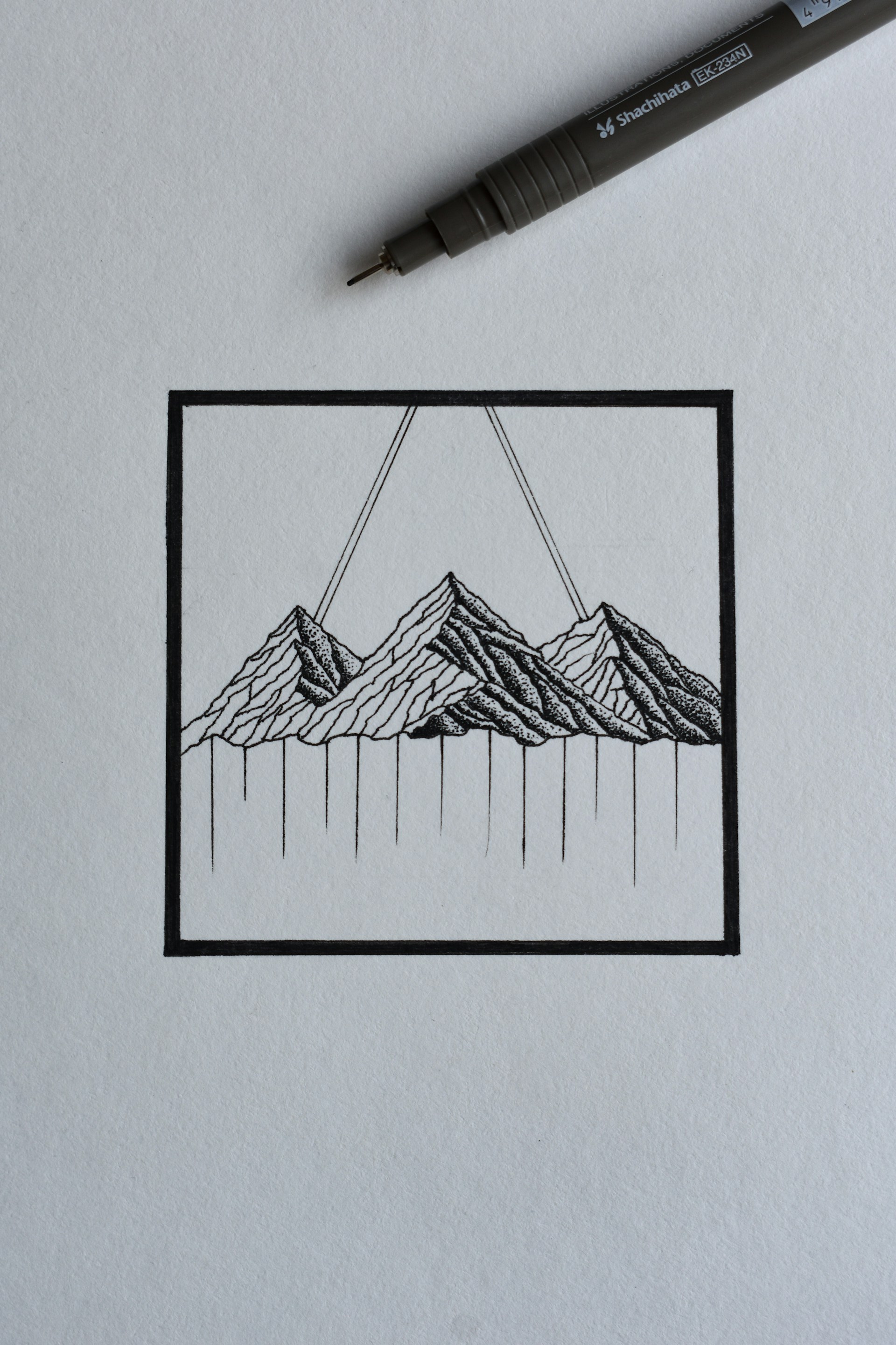A delicate fine line tattoo of a mountain range inspired by Montana's vast landscapes, inked in soft black and sage green hues.
