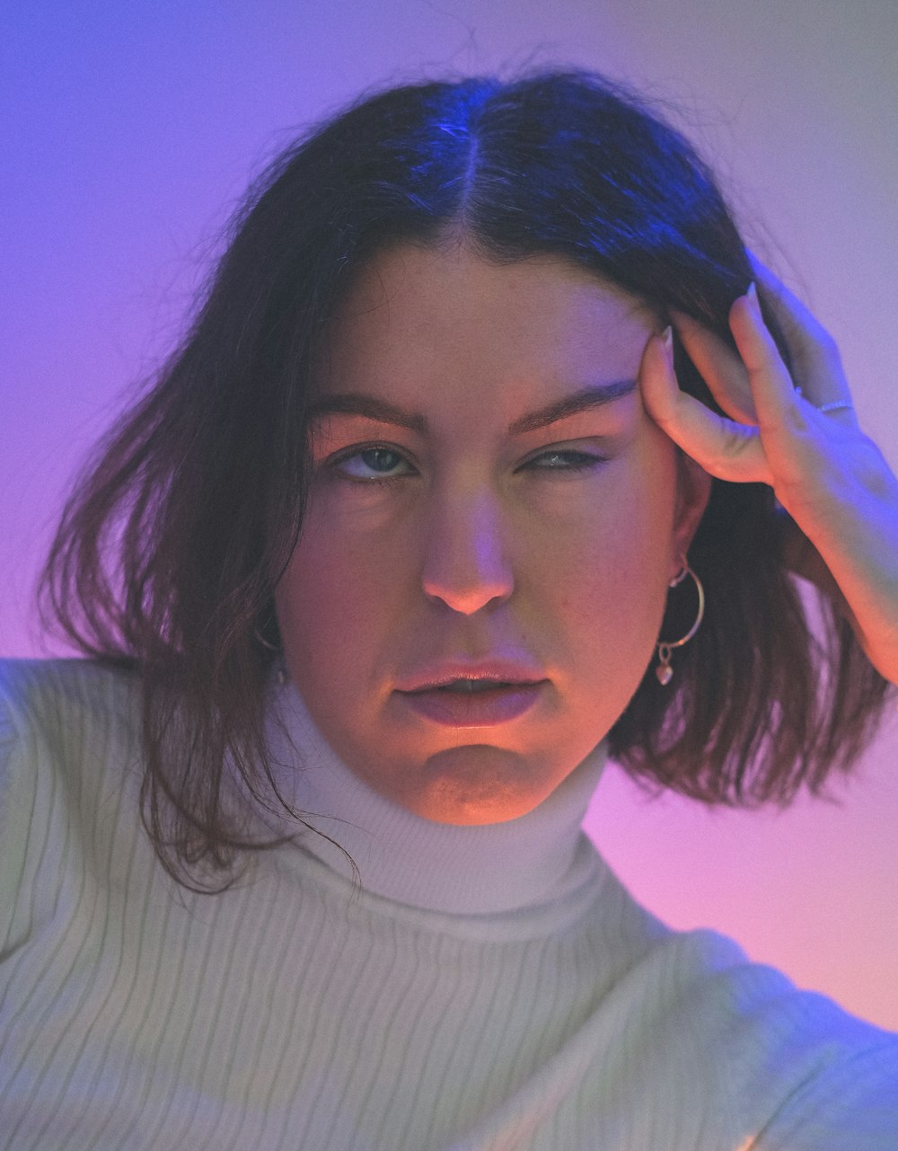 woman in white turtleneck sweater