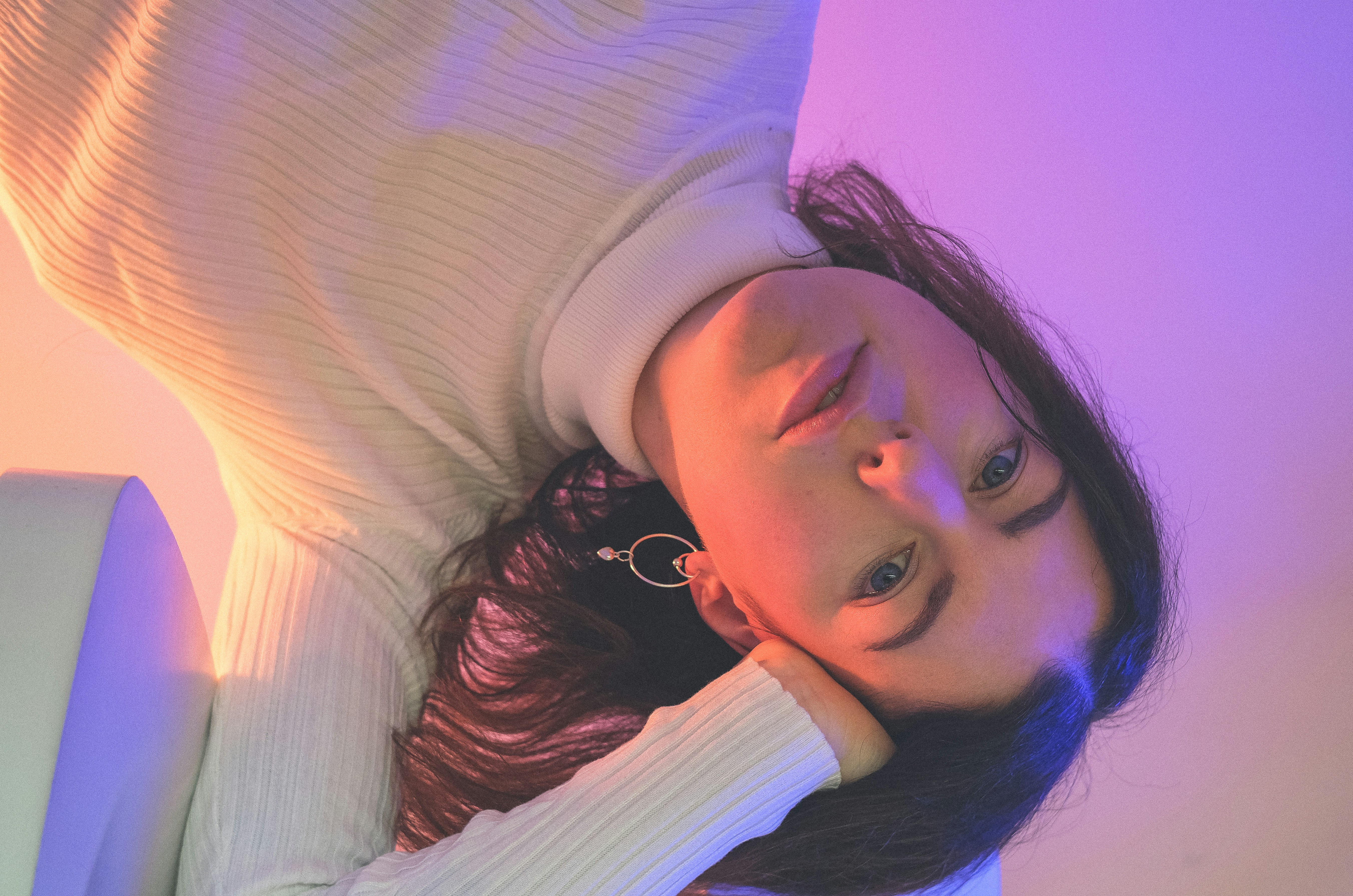 Woman in white and gray long sleeve shirt