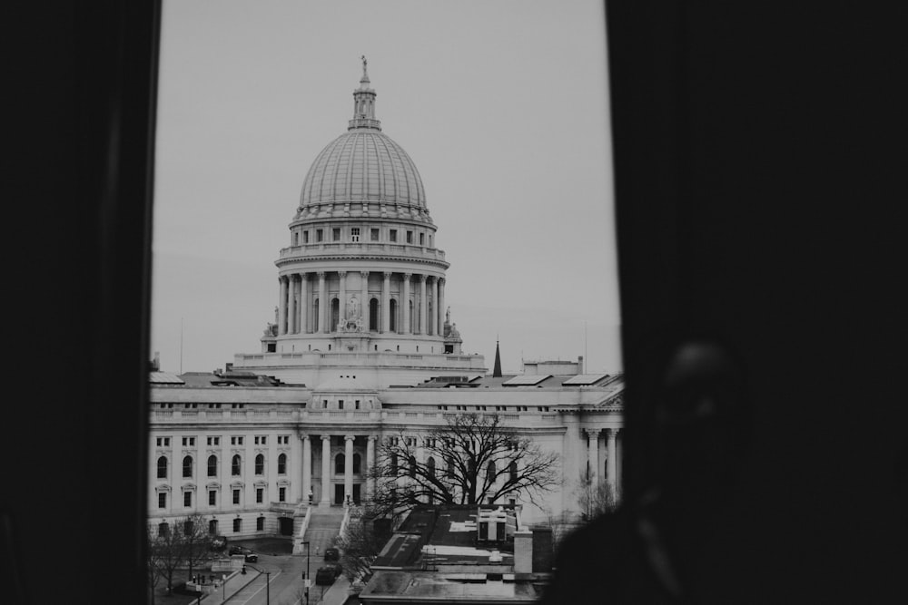 grayscale photo of white concrete building