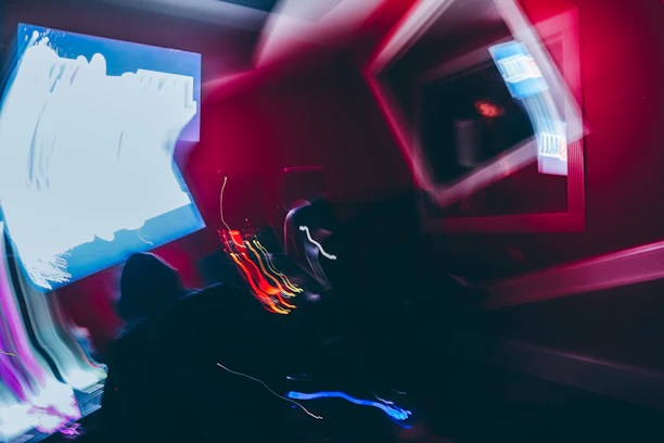 An abstract lab scene with glowing tech devices and a faint overlay of handwritten story notes.