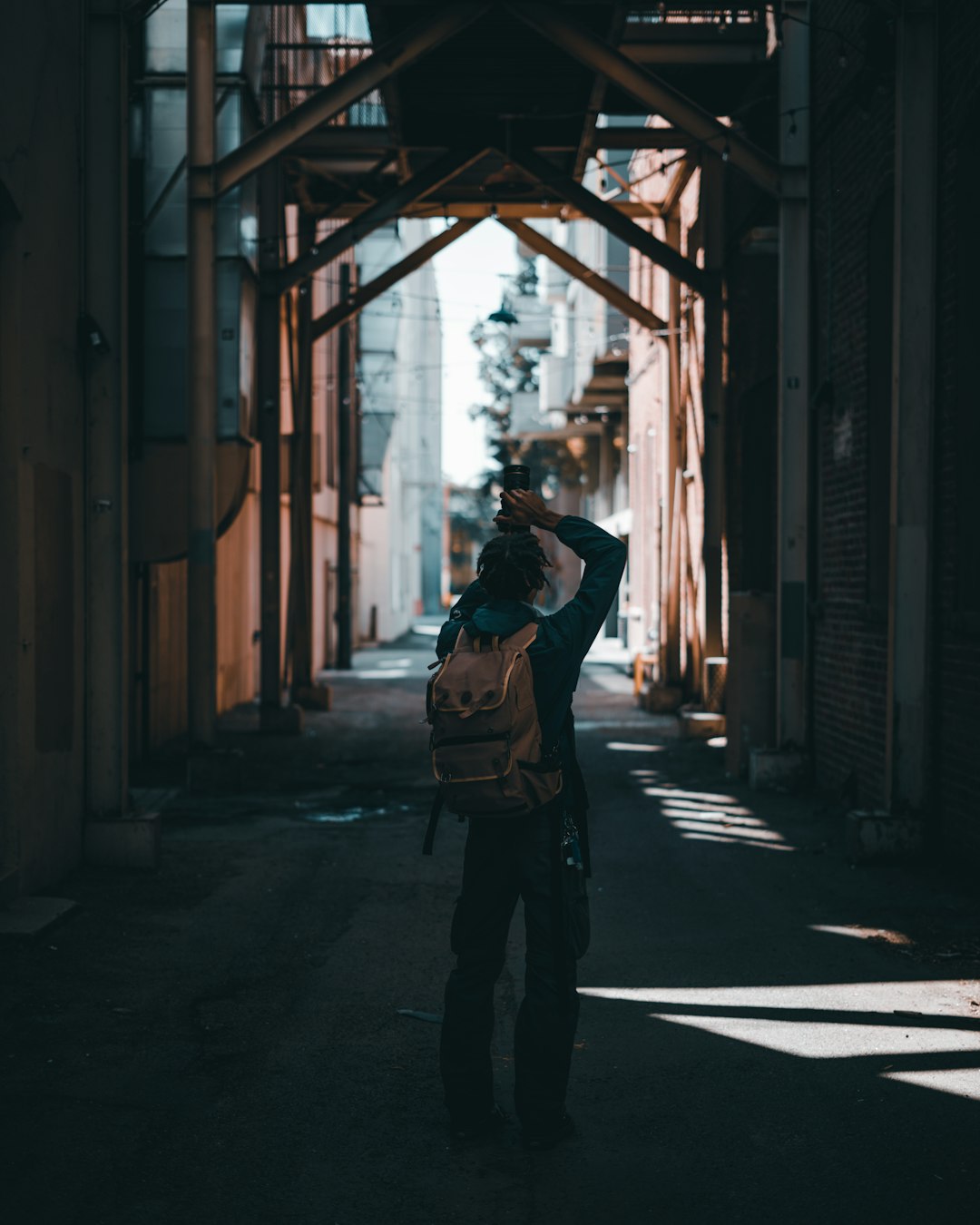 woman in black jacket standing on hallway