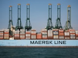 cargo ship on body of water during daytime