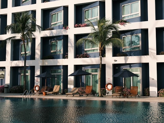green palm tree near swimming pool
