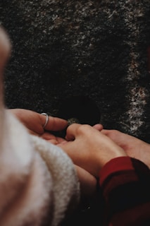 A close-up of hands gently holding a sensory fidget toy with soft textures.