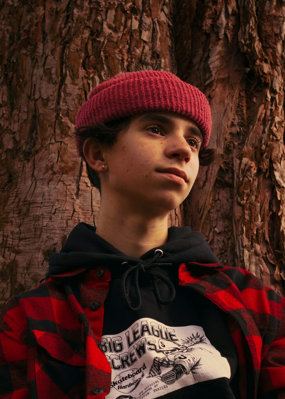 man in red knit cap and red and black jacket