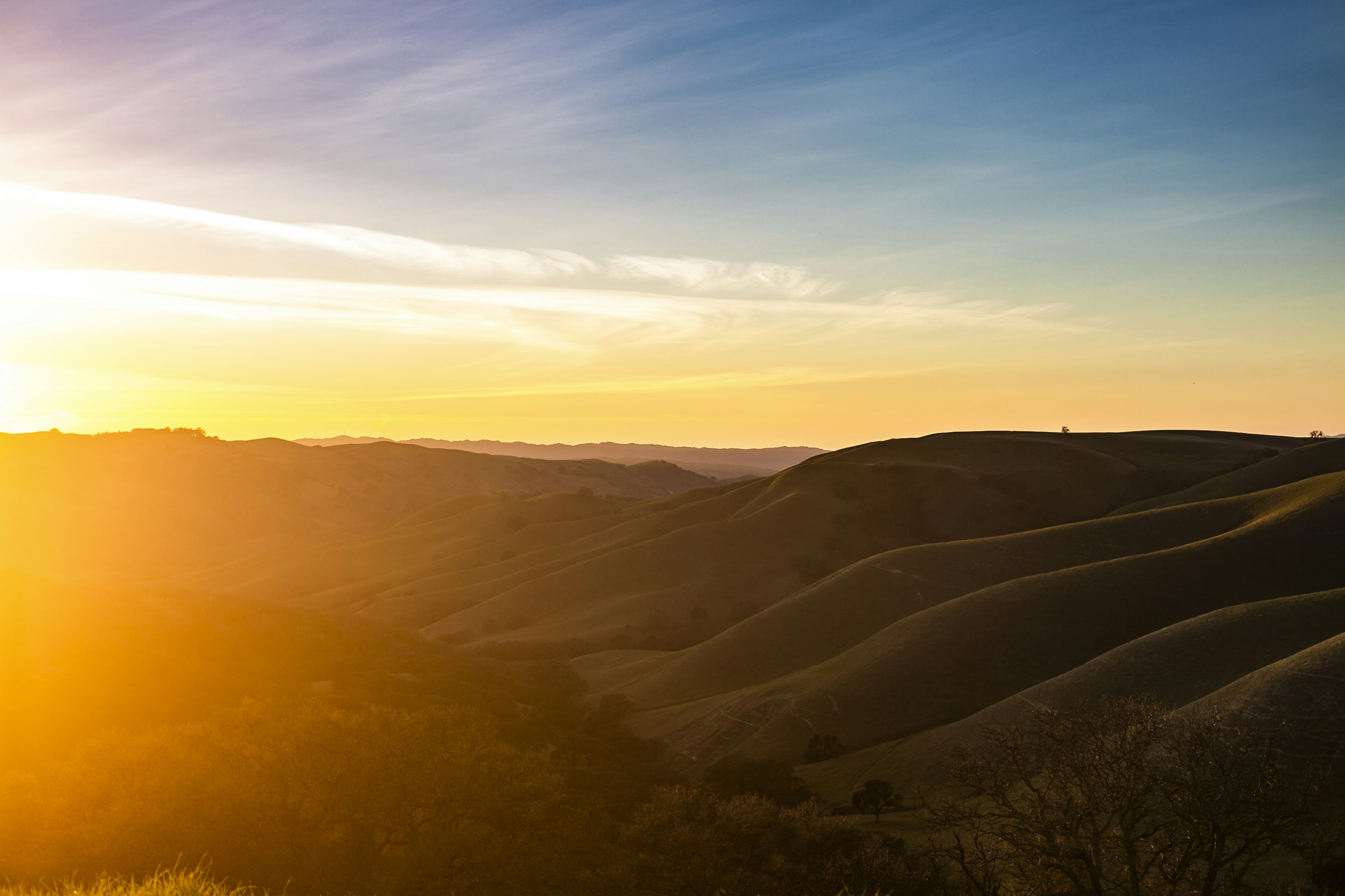 A view of the hills landscape at sunset from the top of Del Valle in Livermore, CA in the San Francisco Bay Area.