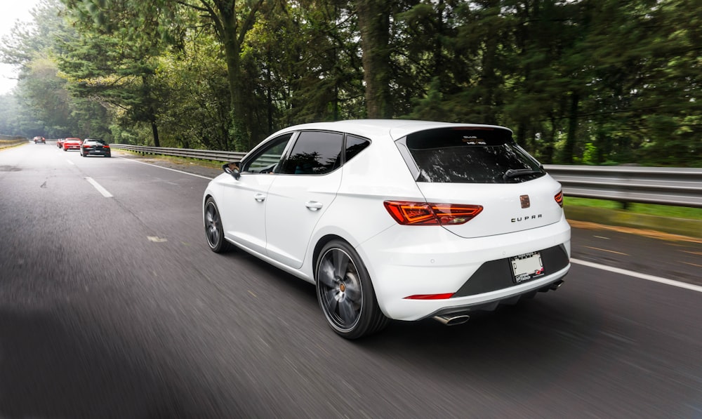 white bmw m 3 coupe on road during daytime