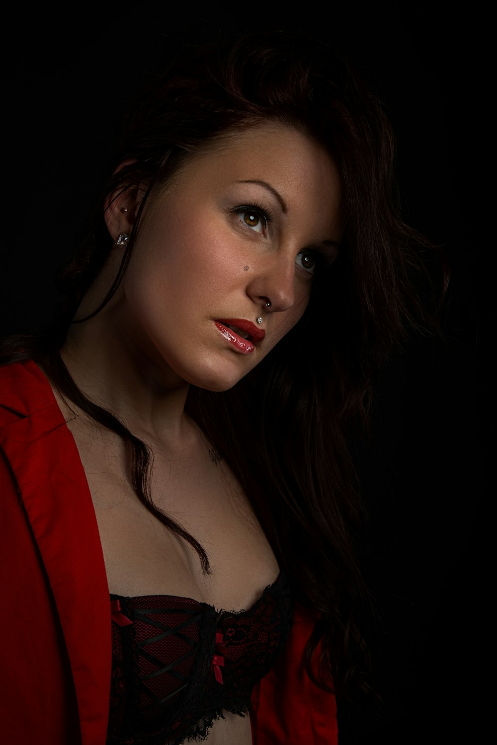 woman in red blazer and black shirt