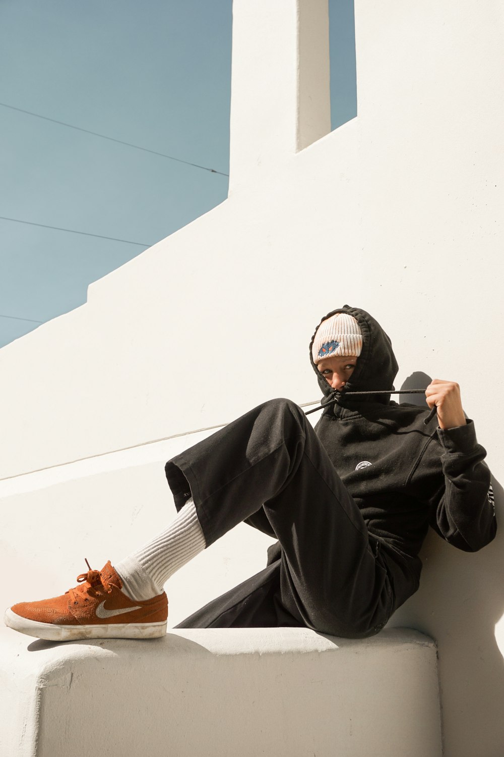 man in black jacket wearing black sunglasses