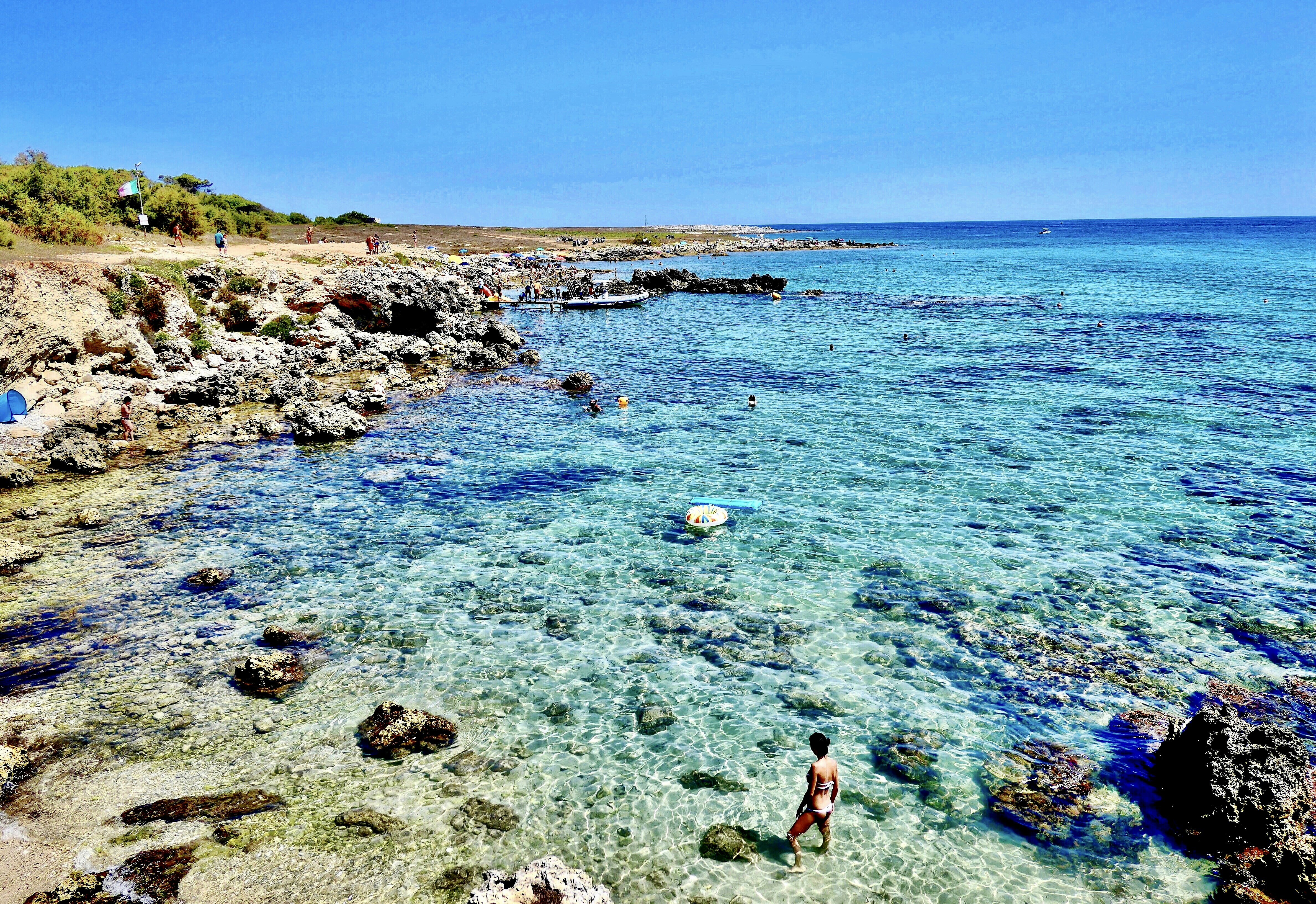 woman in red bikini standing on seashore during daytime, Spiaggia di Baia dell’Orte