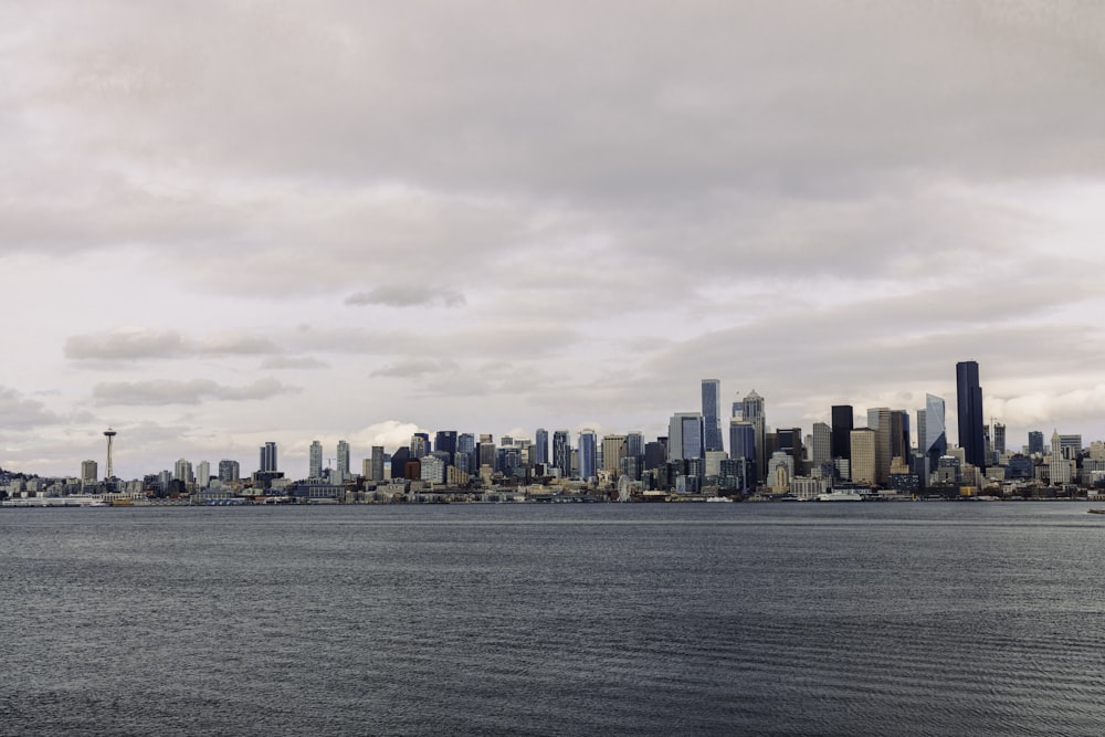 city skyline under white clouds during daytime