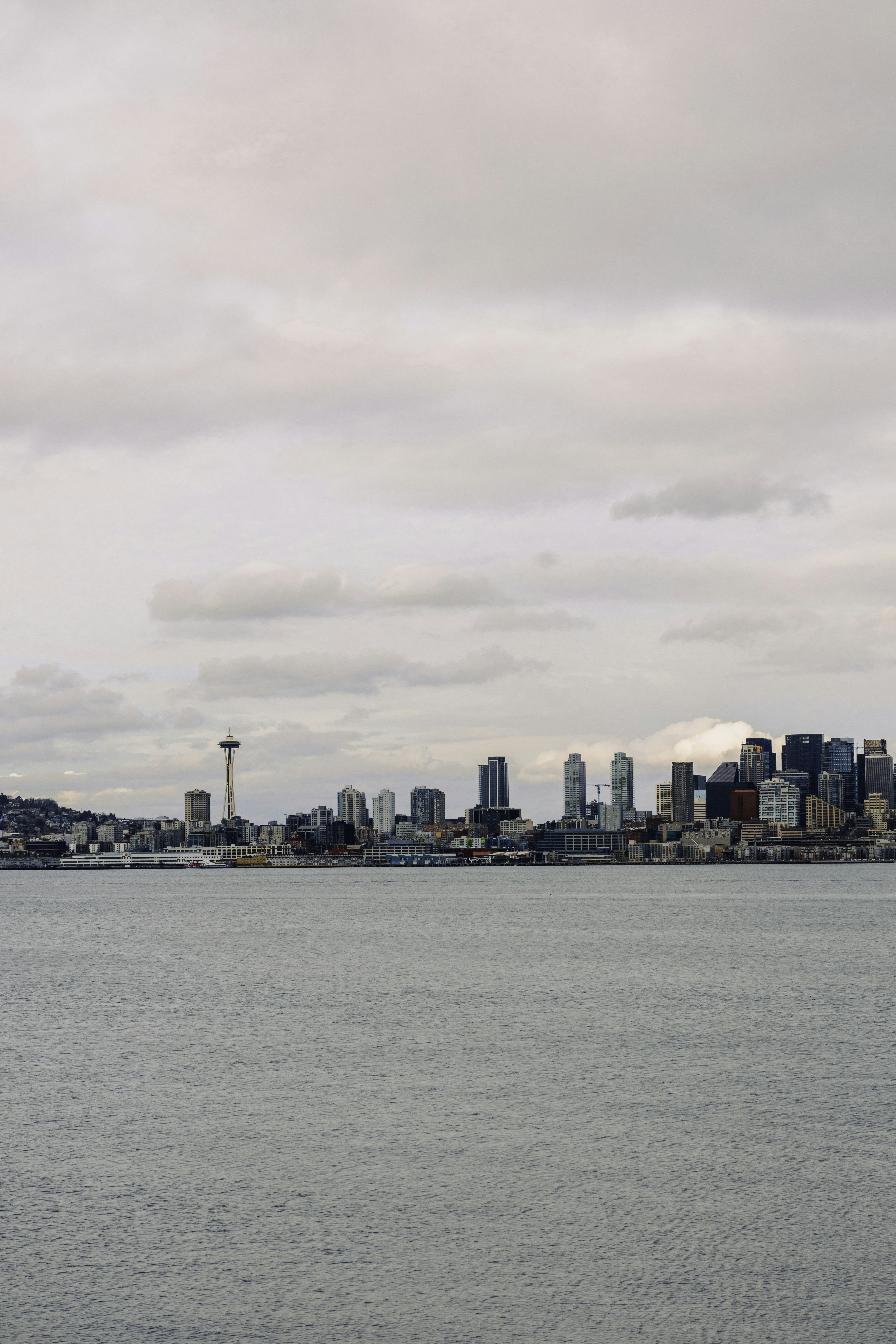 city skyline under cloudy sky during daytime