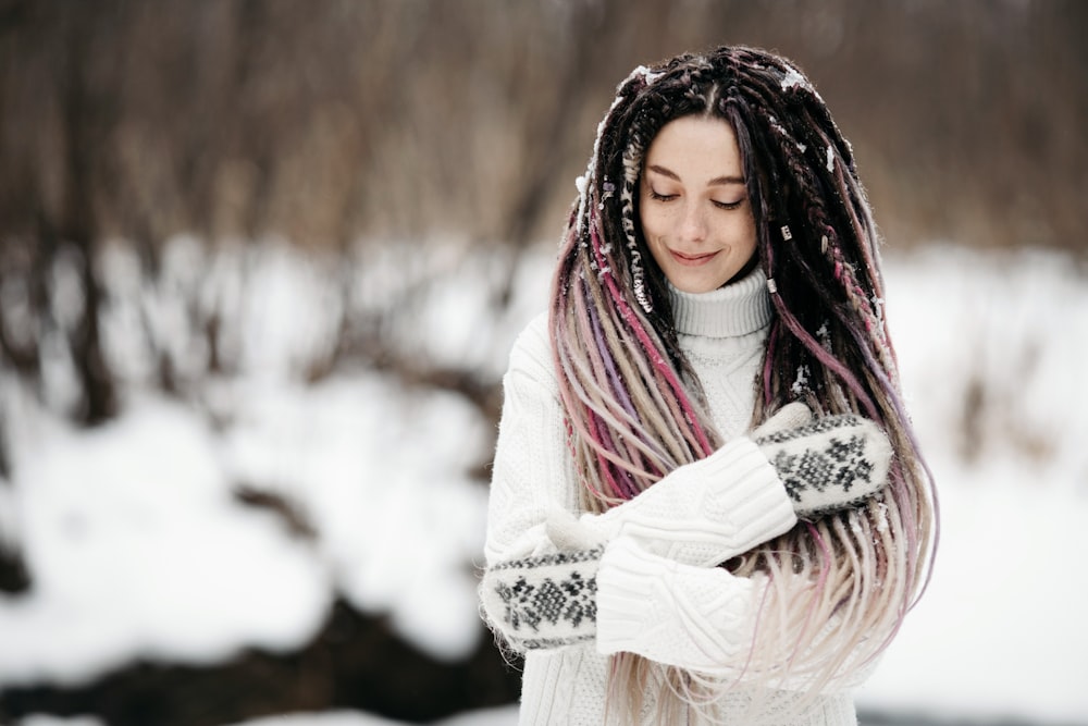 woman in white long sleeve shirt and red white scarf