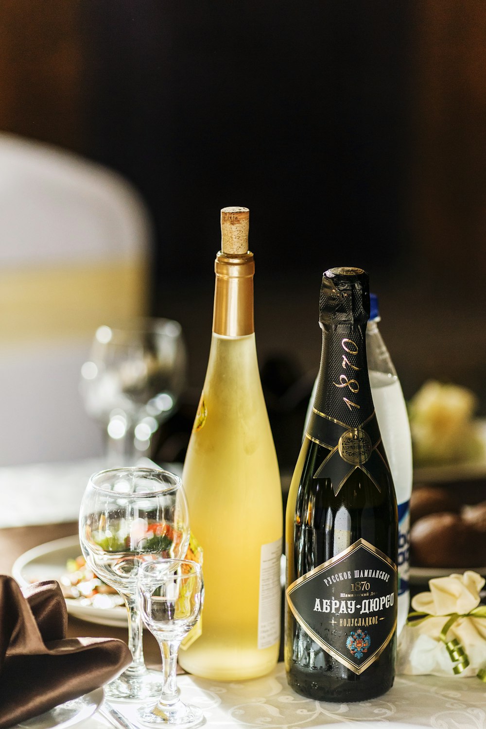 selective focus photography of black glass bottle on table