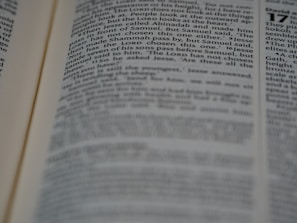 A close-up of a student reading theological texts.