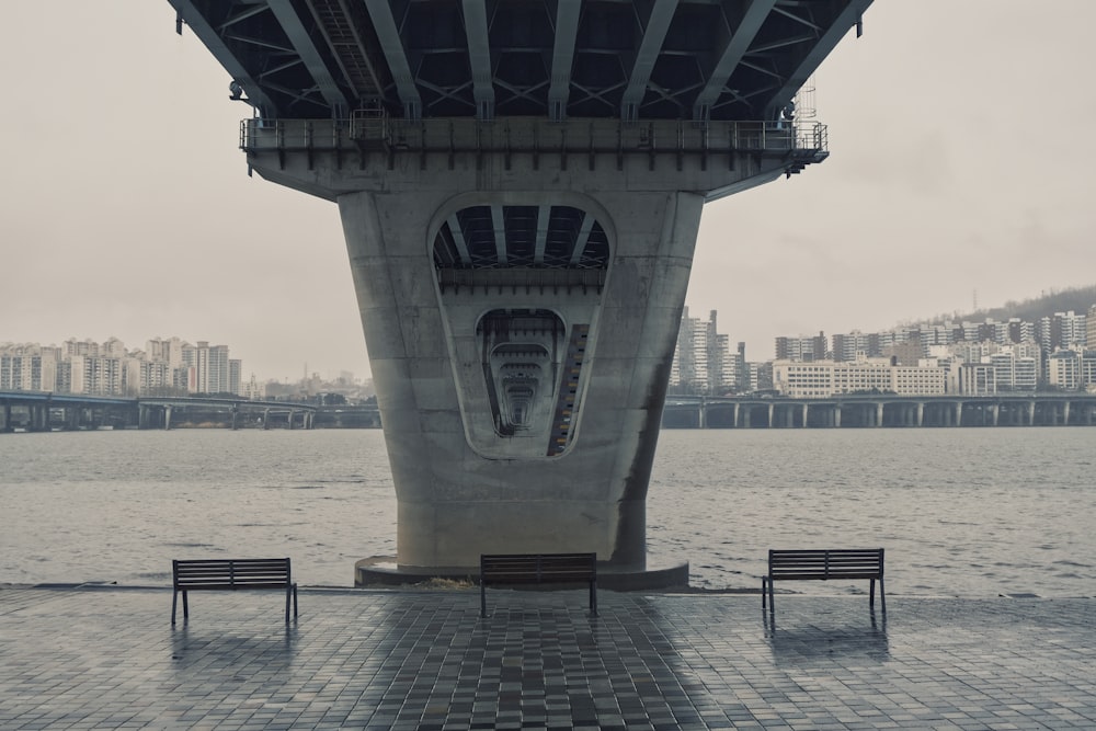 white concrete bridge over body of water during daytime