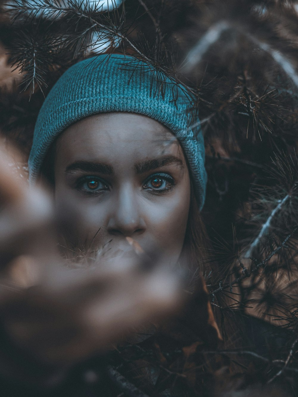 woman in blue knit cap