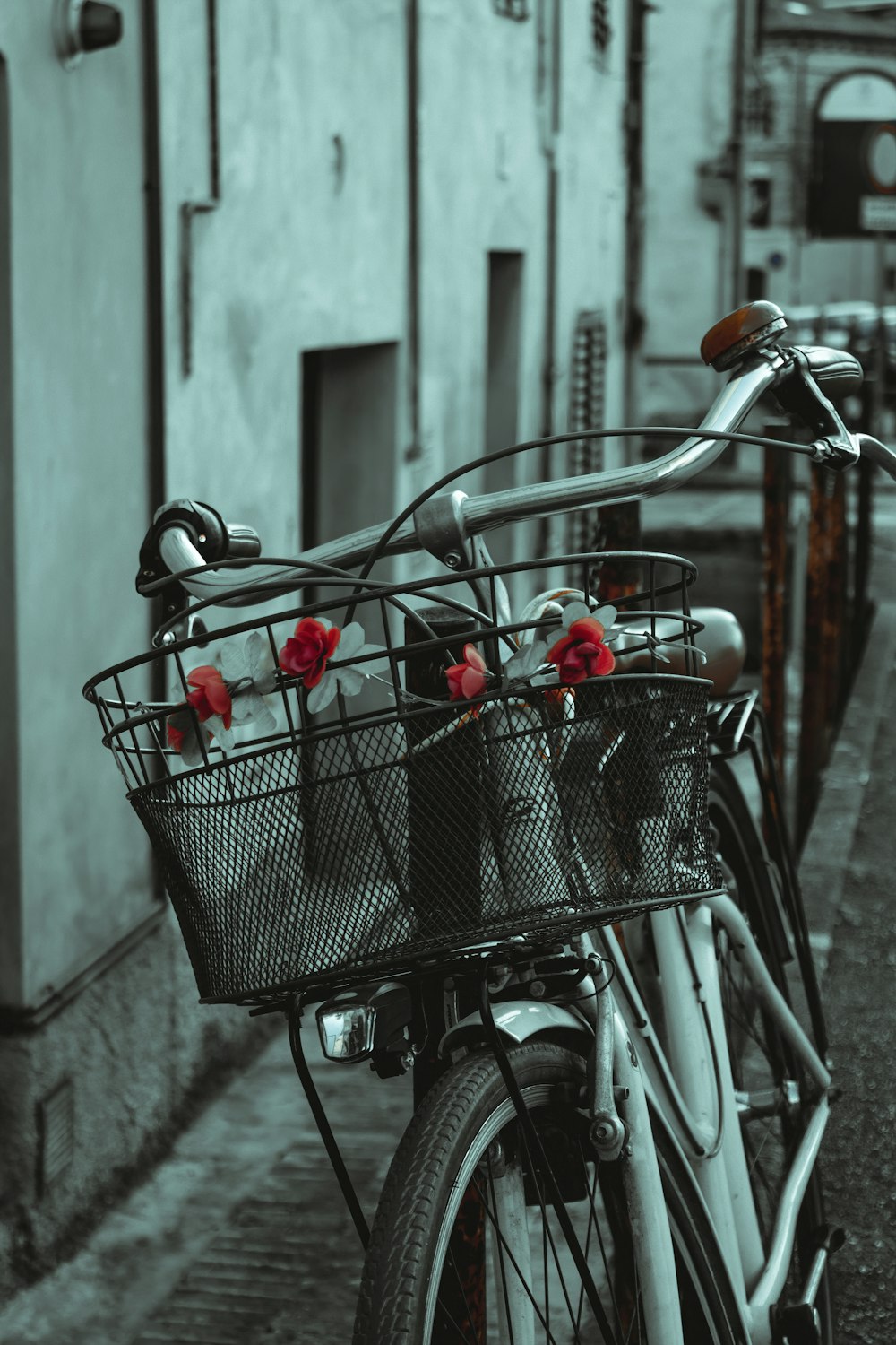 red and white plastic toys in black metal shopping cart