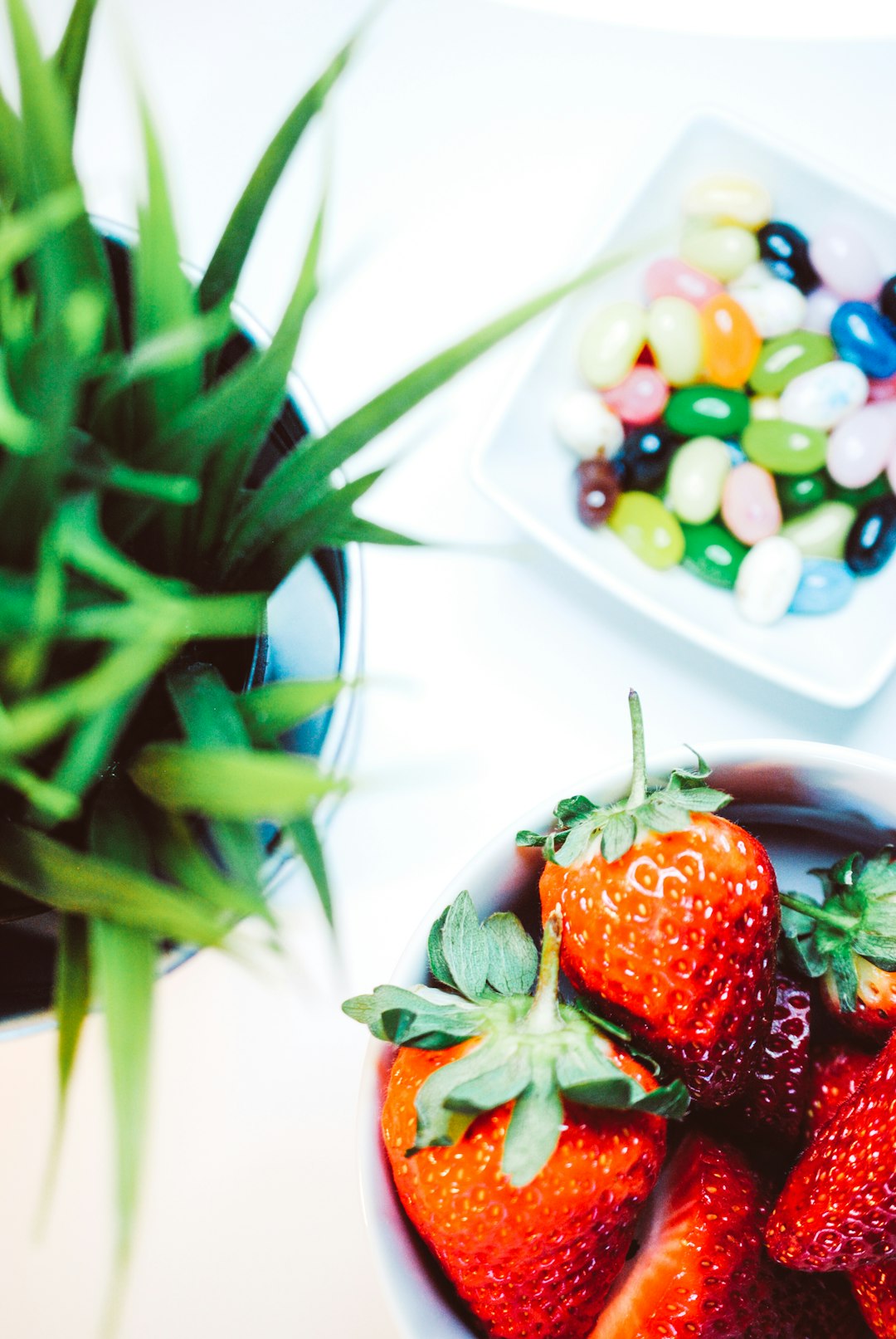 red strawberries on white ceramic plate