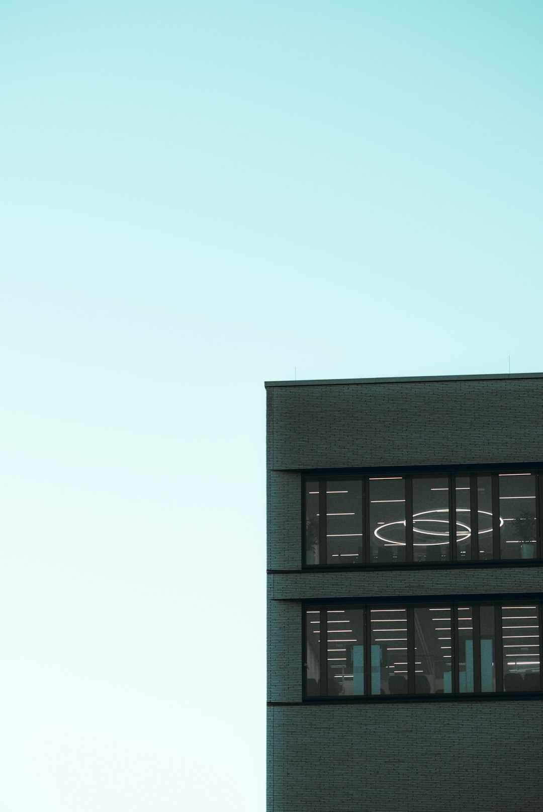 black concrete building under white sky during daytime