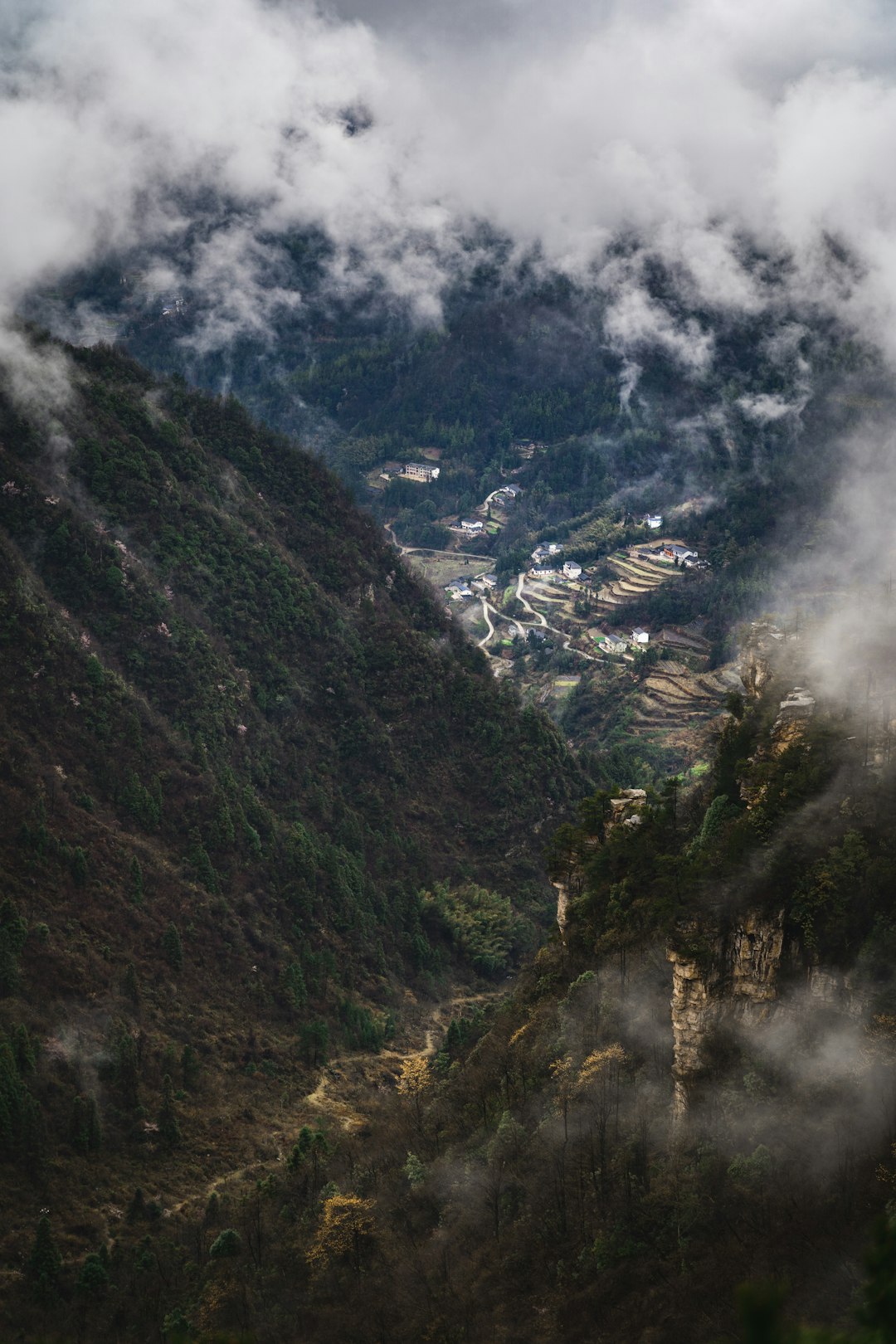 green and gray mountain under white clouds during daytime