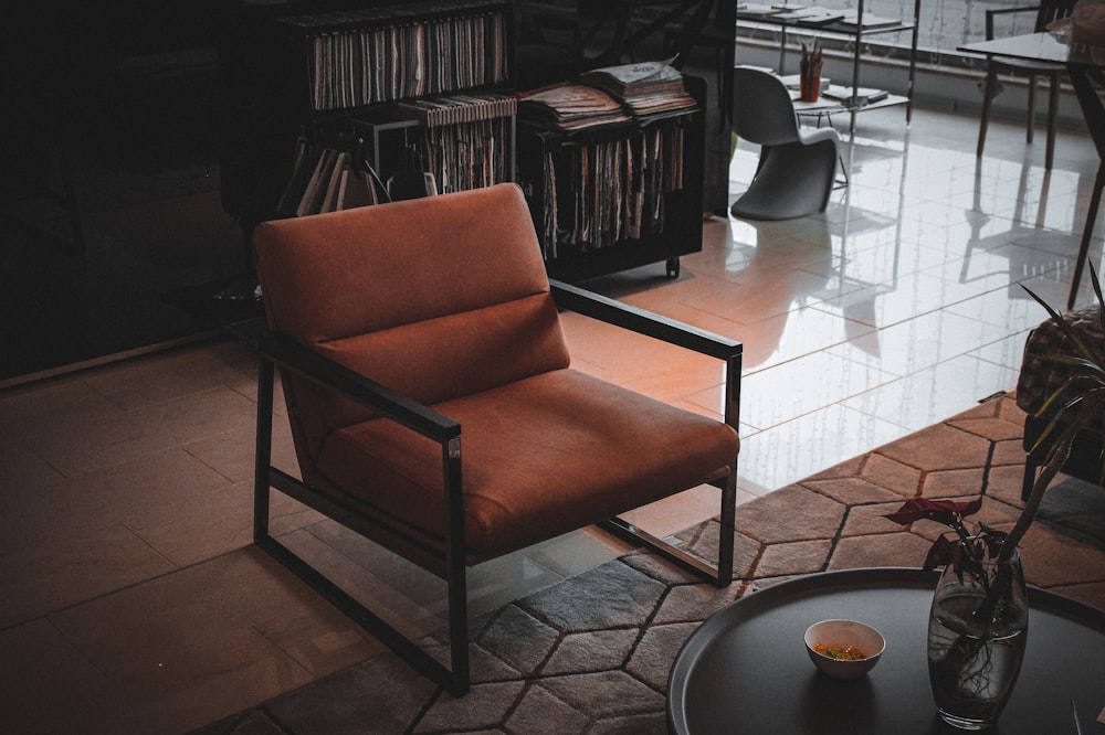 brown and black armchair beside brown wooden table