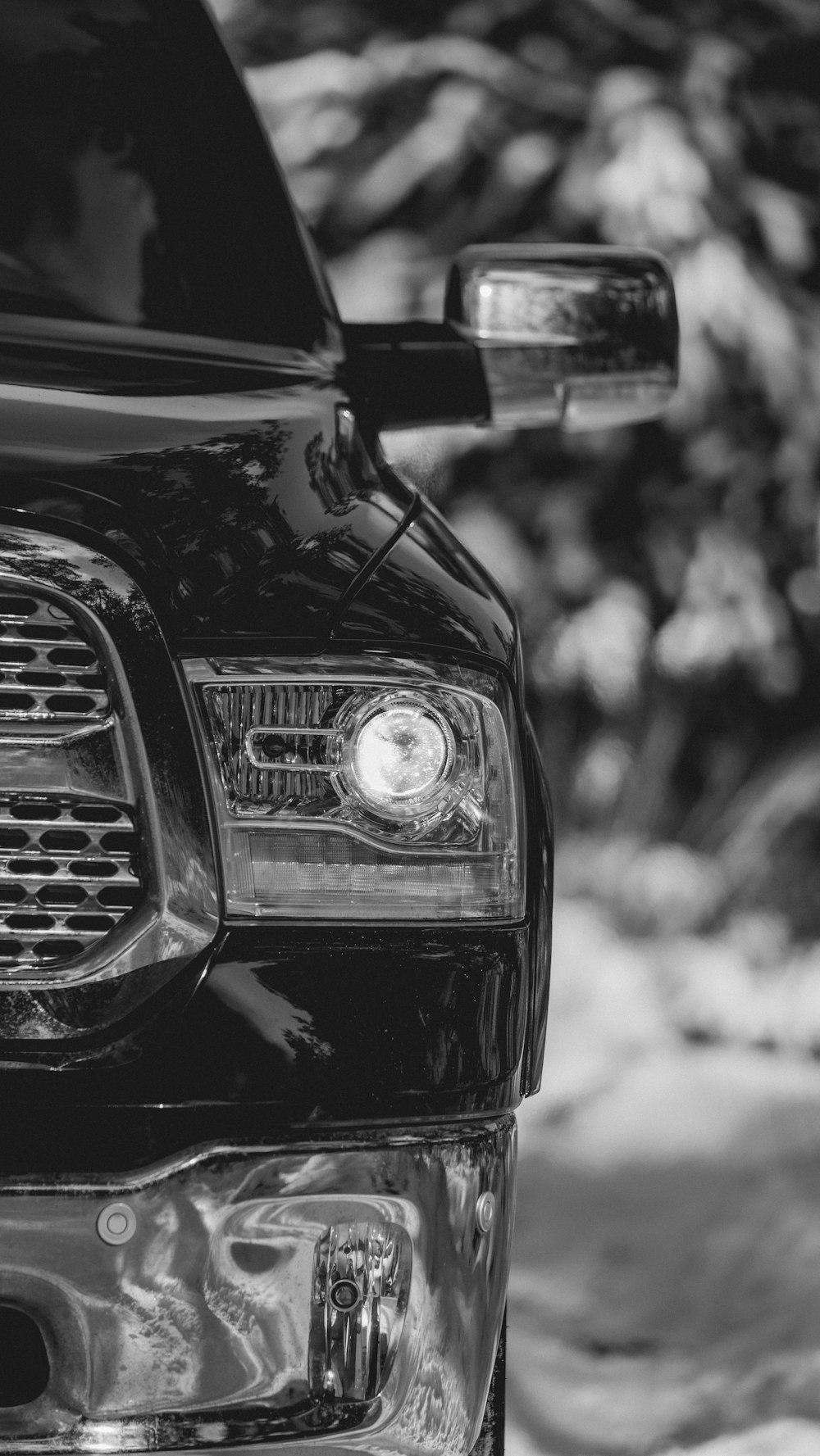 grayscale photo of cars headlight