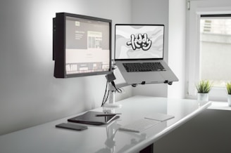 macbook pro on white table